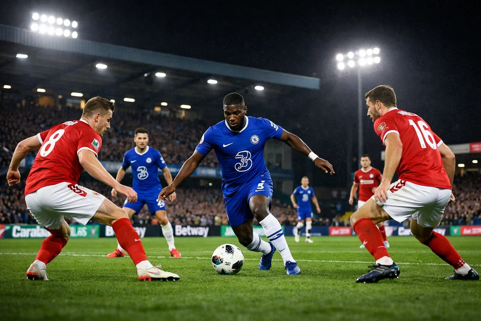 Football match action under floodlights during an evening cup tie