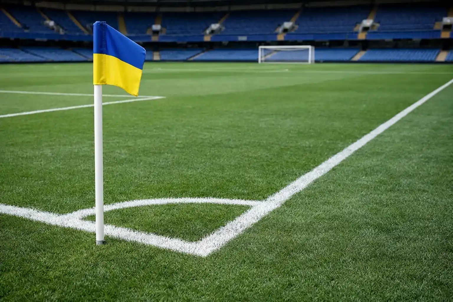 Football match wide shot showing corner flag and pitch markings