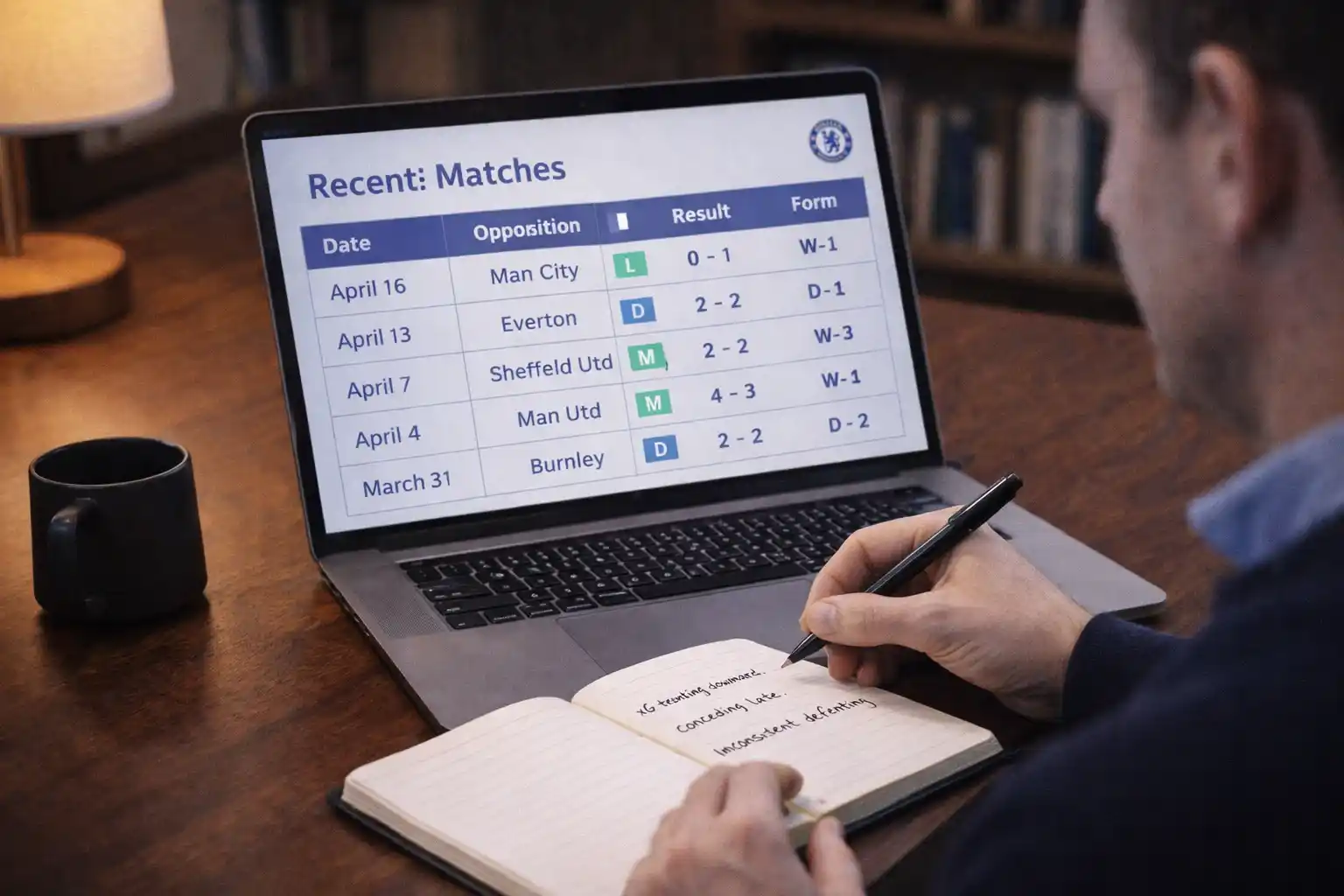 Person reviewing match results and form data in a notebook with laptop nearby