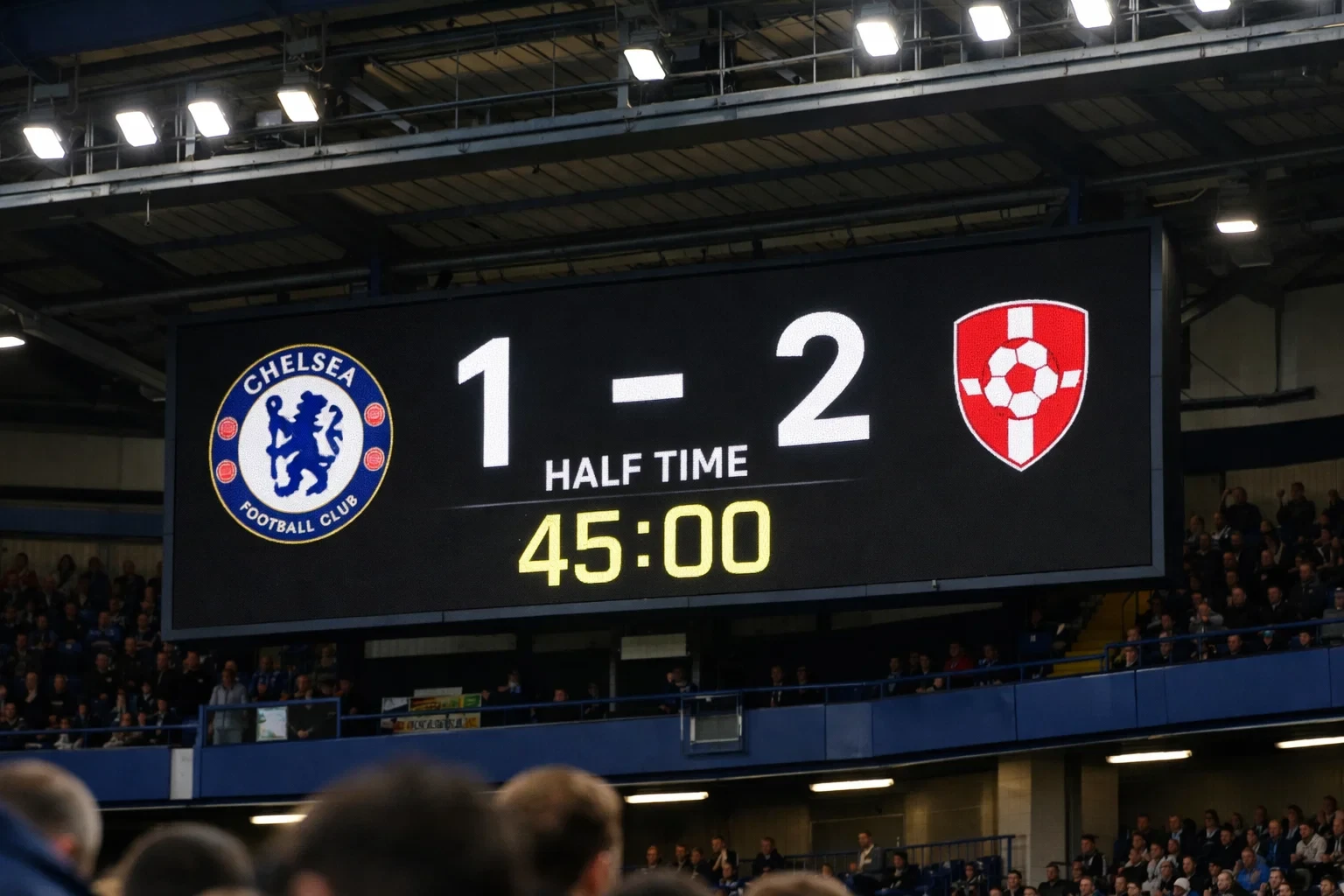 Stadium scoreboard showing halftime with the match clock at 45 minutes
