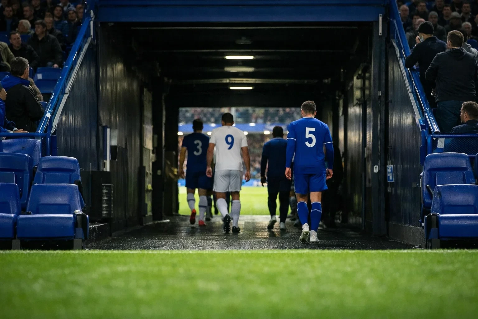 Football stadium tunnel entrance with players returning for the second half