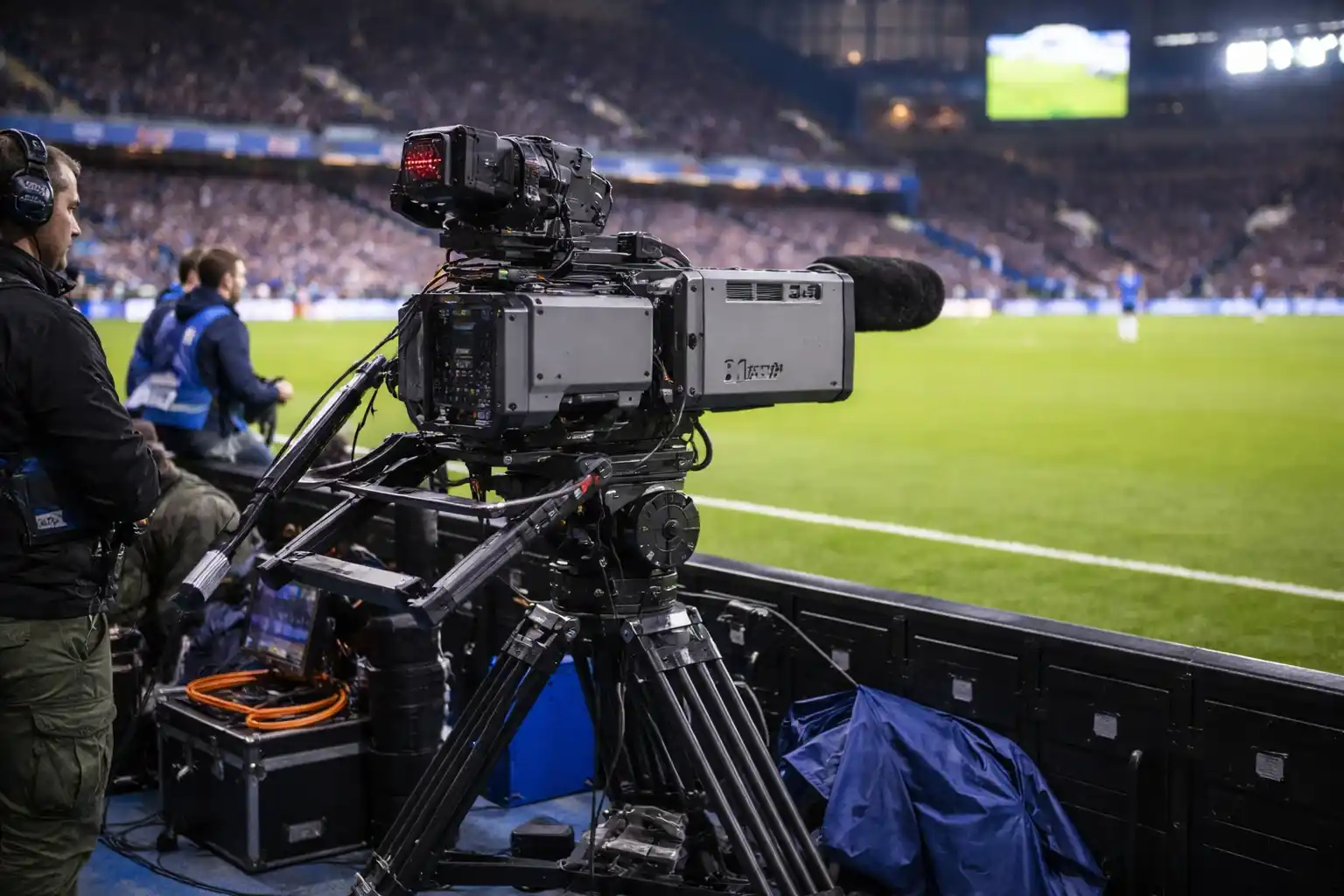 Television broadcast camera crew filming a Premier League match