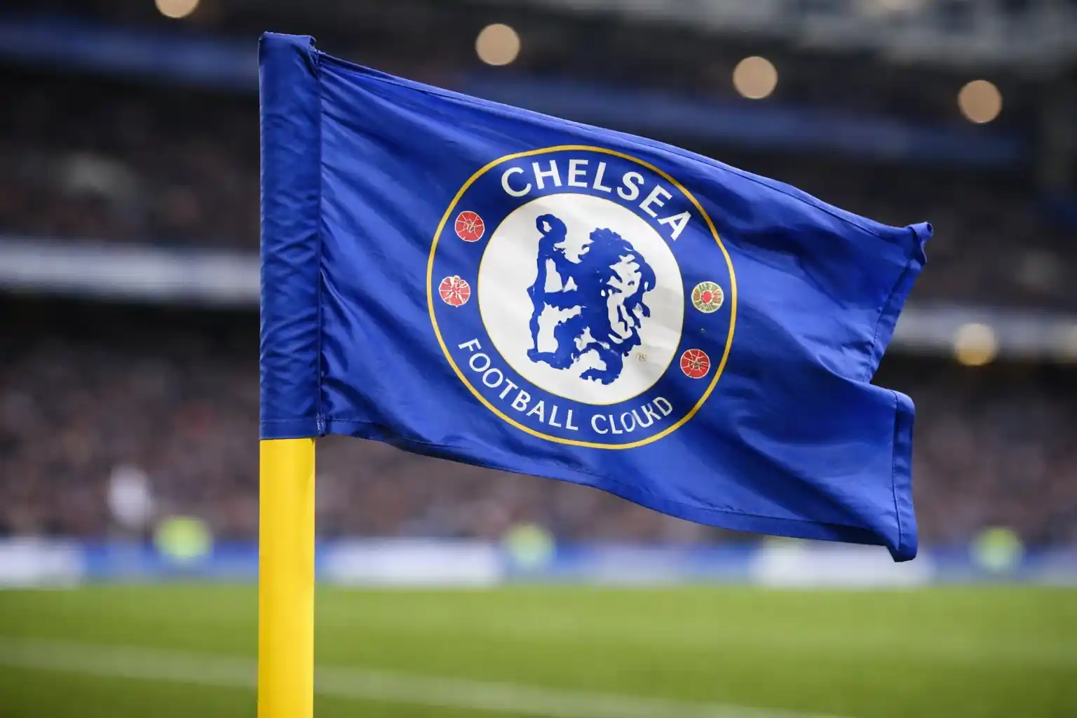 Corner flag blowing strongly in wind at a football stadium